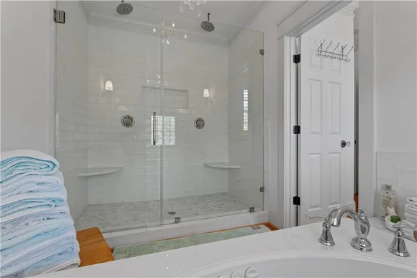 a view of storage and utility room with washer and dryer