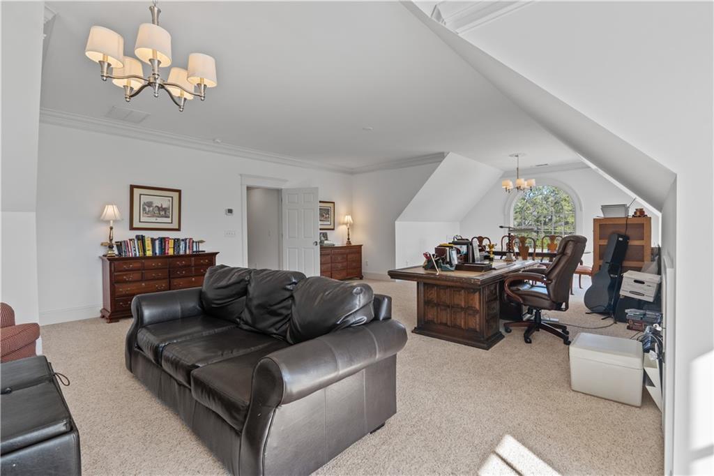 31 Duck Pond Road Roopville, GA 30170 - Photo 80 of 136 a living room with furniture chandelier and a window