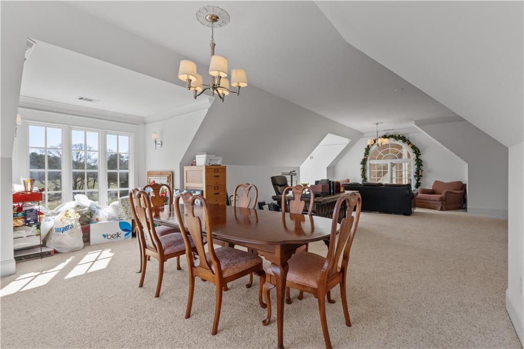 31 Duck Pond Road Roopville, GA 30170 - Photo 81 of 136 a view of a dining room with furniture and a chandelier