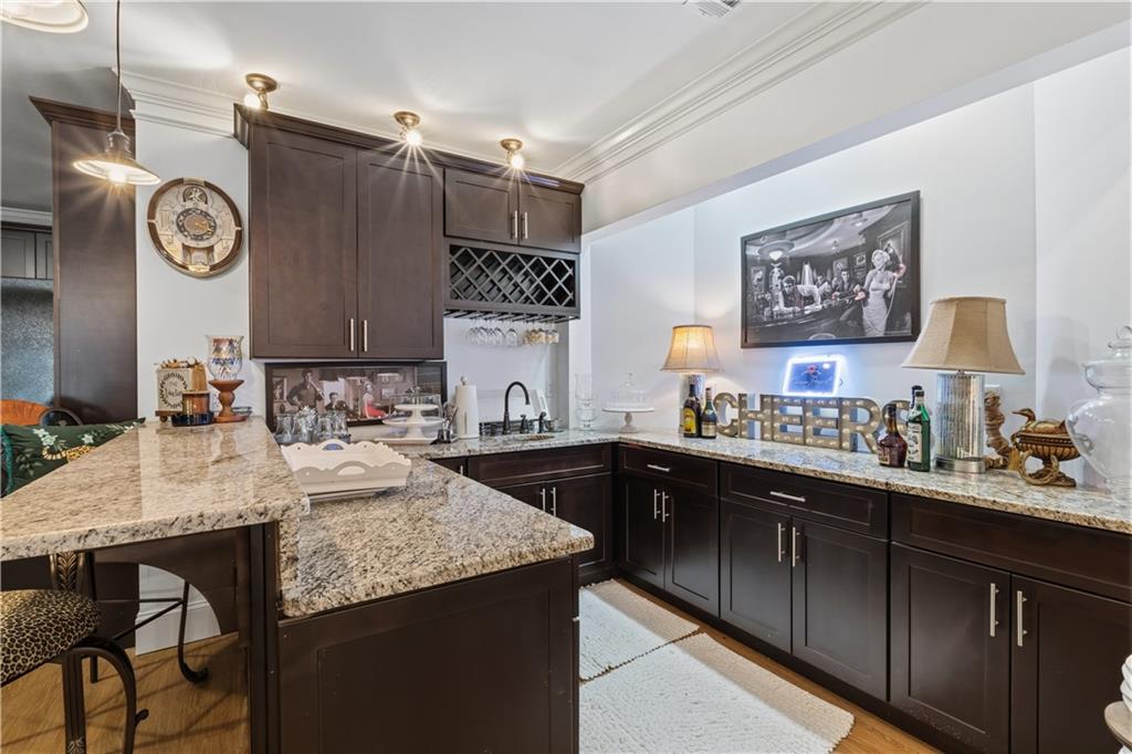 31 Duck Pond Road Roopville, GA 30170 - Photo 95 of 136 a kitchen with granite countertop a sink cabinets and stove