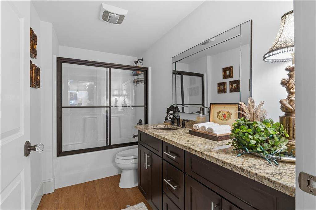 31 Duck Pond Road Roopville, GA 30170 - Photo 99 of 136 a bathroom with a granite countertop sink and a mirror