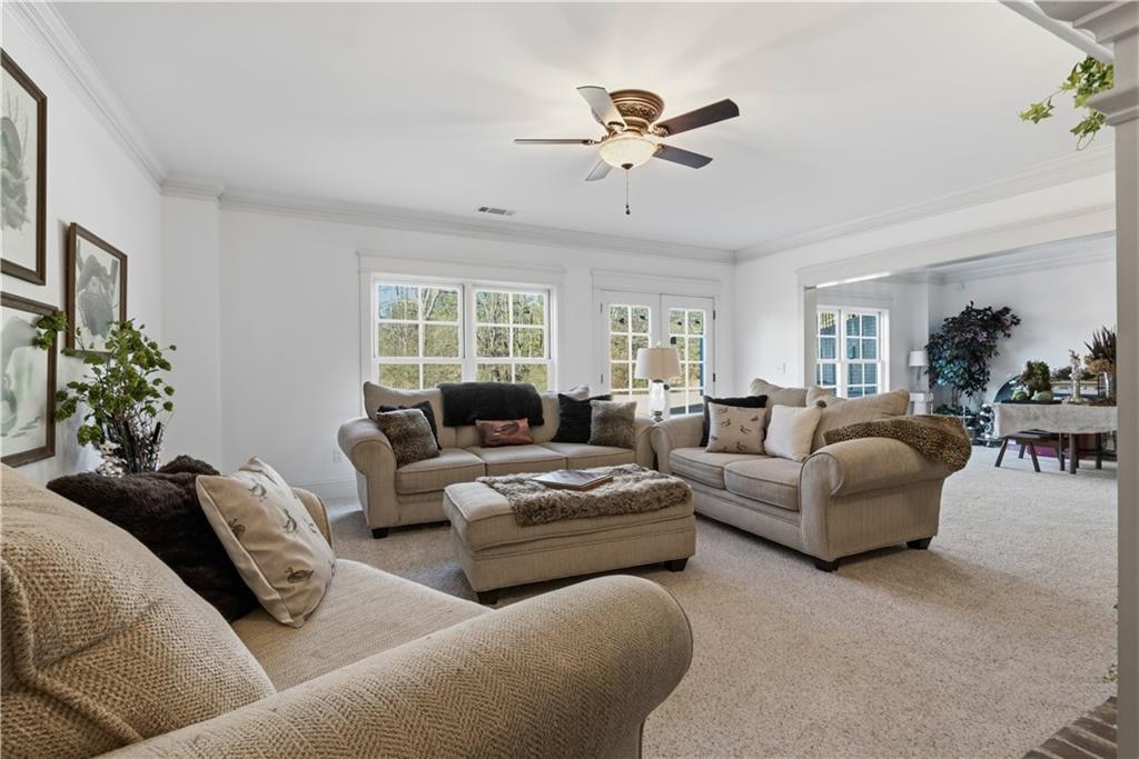 31 Duck Pond Road Roopville, GA 30170 - Photo 100 of 136 a living room with furniture and a large window