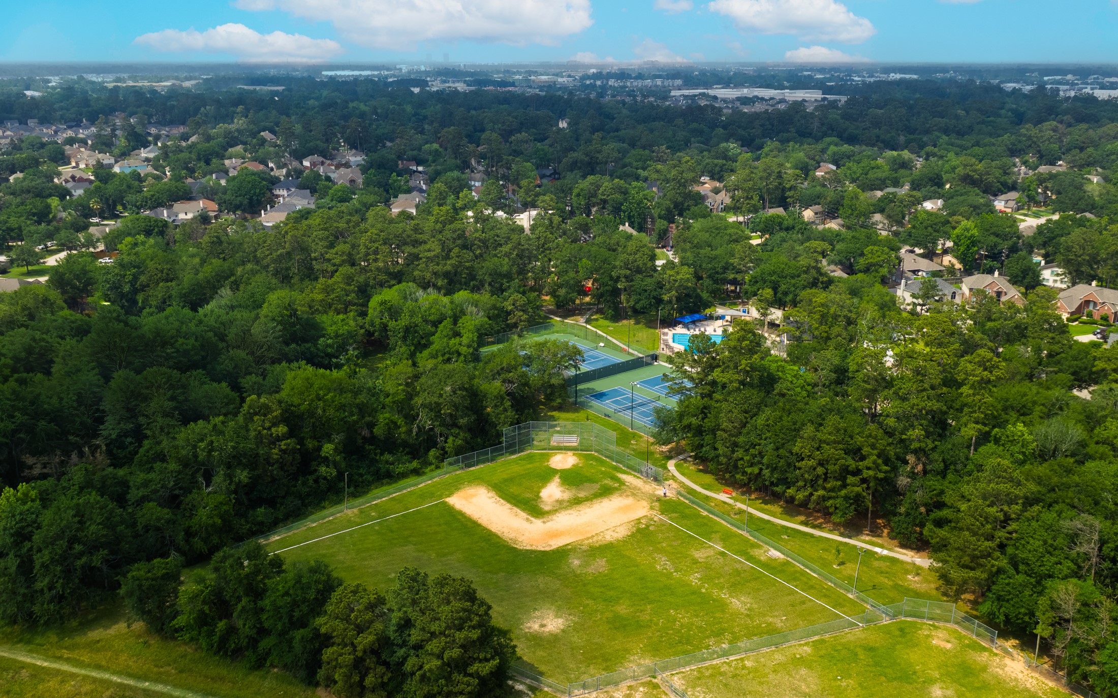 20214 Woodsboro Court Spring, TX 77388 - Photo 49 of 50 Oaks of Devonshire features a 5-Acre Community Park with Jr. Olympic Pool, 2 Water Slides, Clubhouse/Party Rm, 2 Tennis/Pickle Ball Cts, Pavilion, Basketball Ct, 2 Playgrounds, Soccer Field & Baseball Field, and Walking Trails!