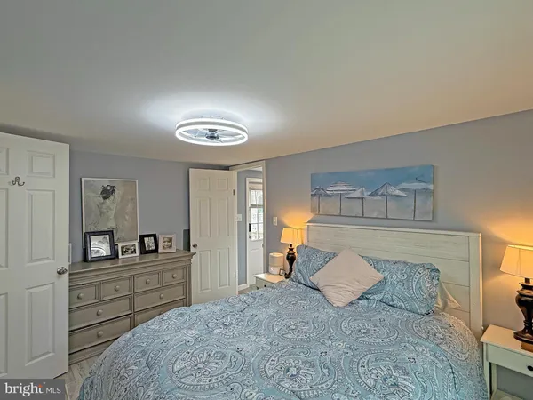 a bedroom with a bed and a couch