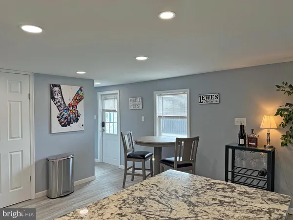 a workspace with furniture window and wooden floor