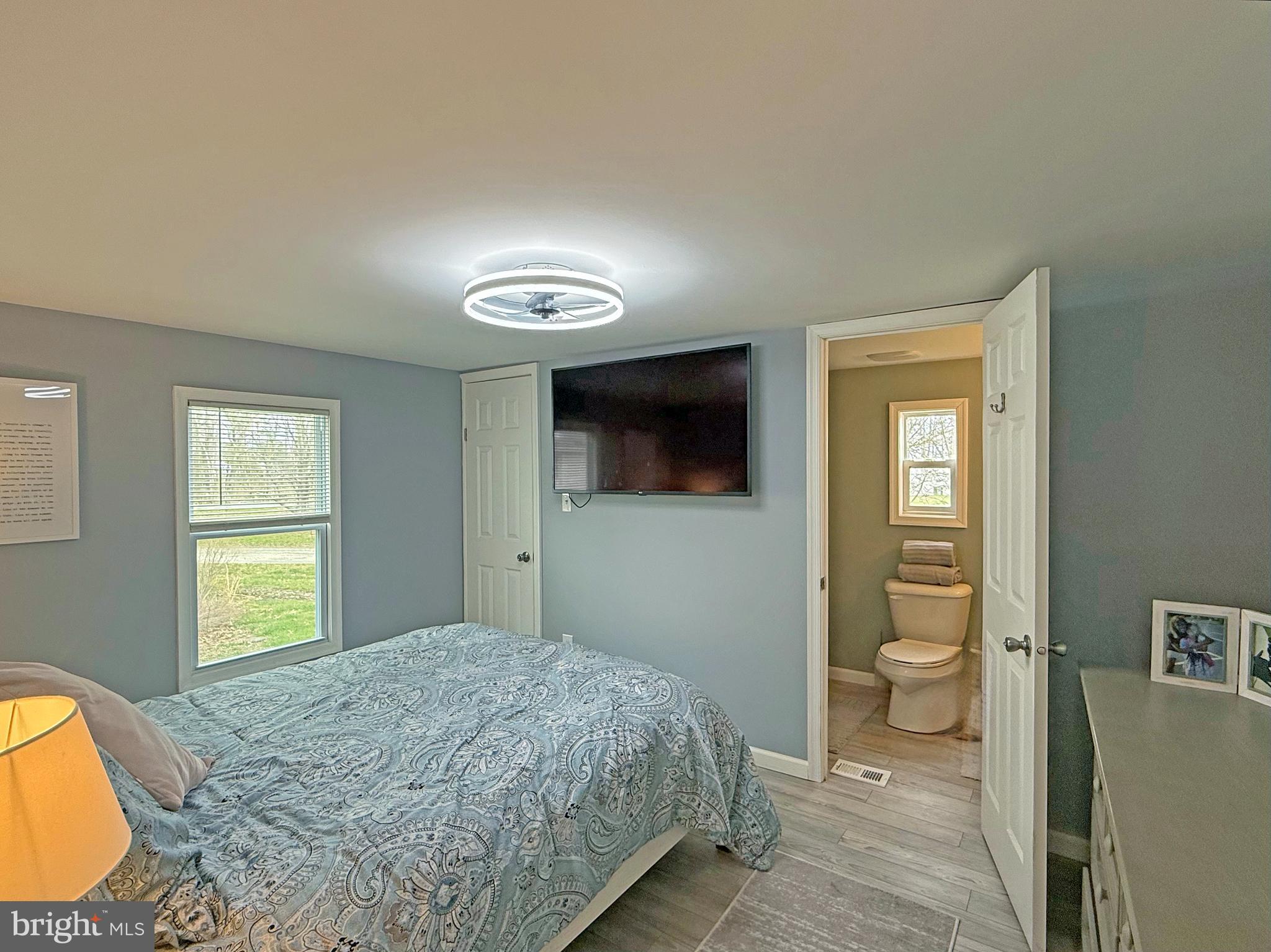 21695 F Street, Unit F40 Rehoboth Beach, DE 19971 - Photo 10 of 29 a bedroom with a bed and a television
