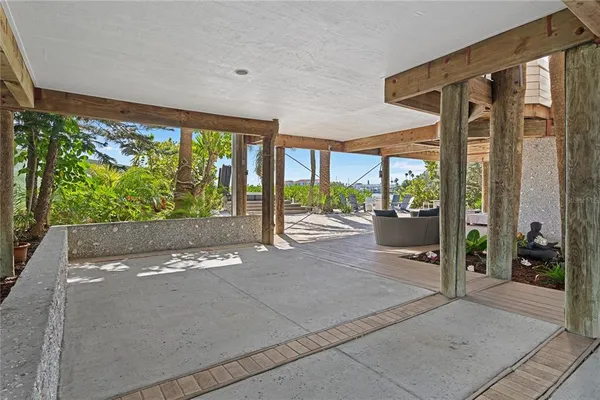 a dining room with wooden floor and outdoor seating
