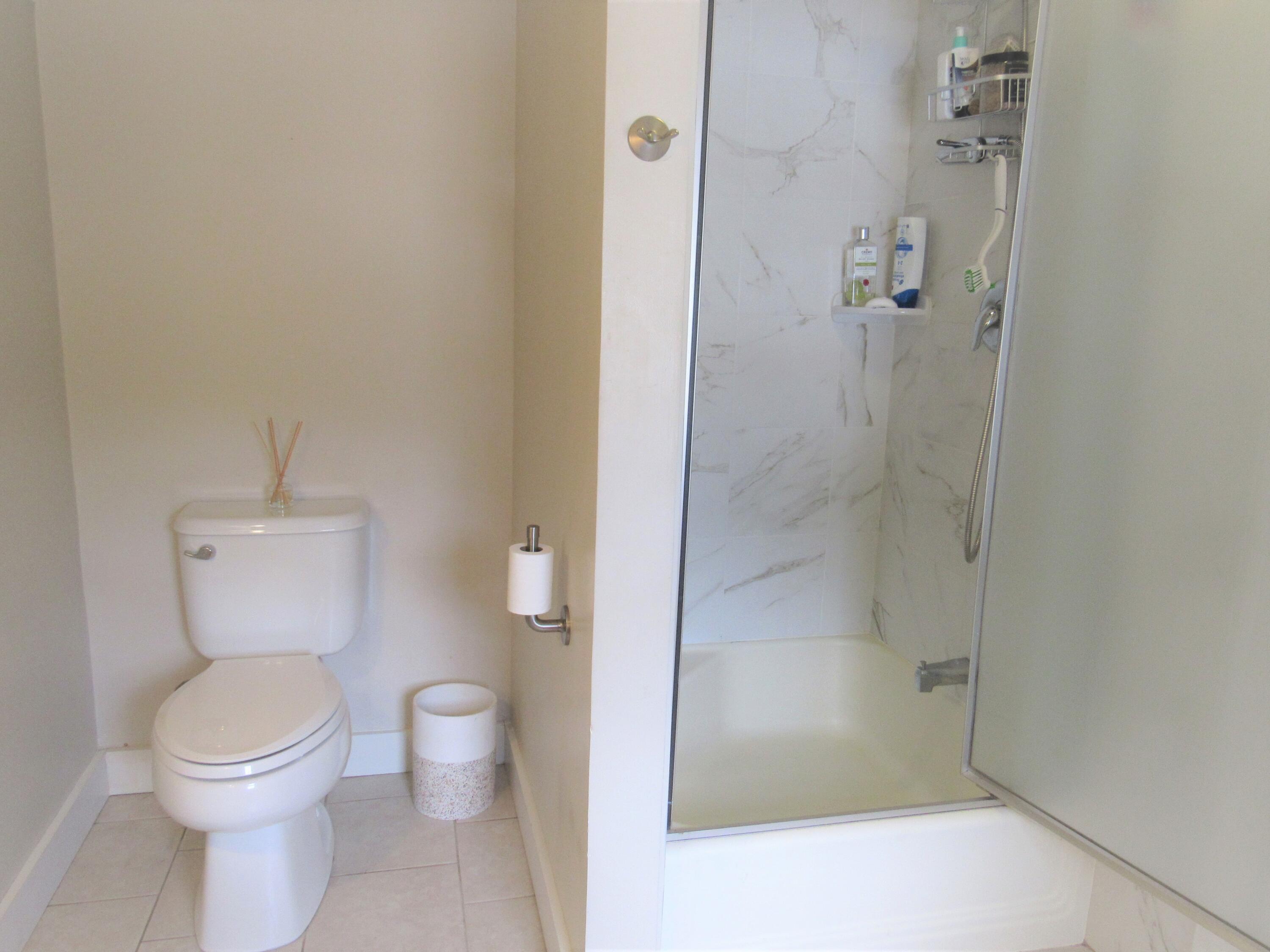 103 Baxter Road Hyannis, MA 02601 - Photo 21 of 31 a bathroom with a toilet and shower