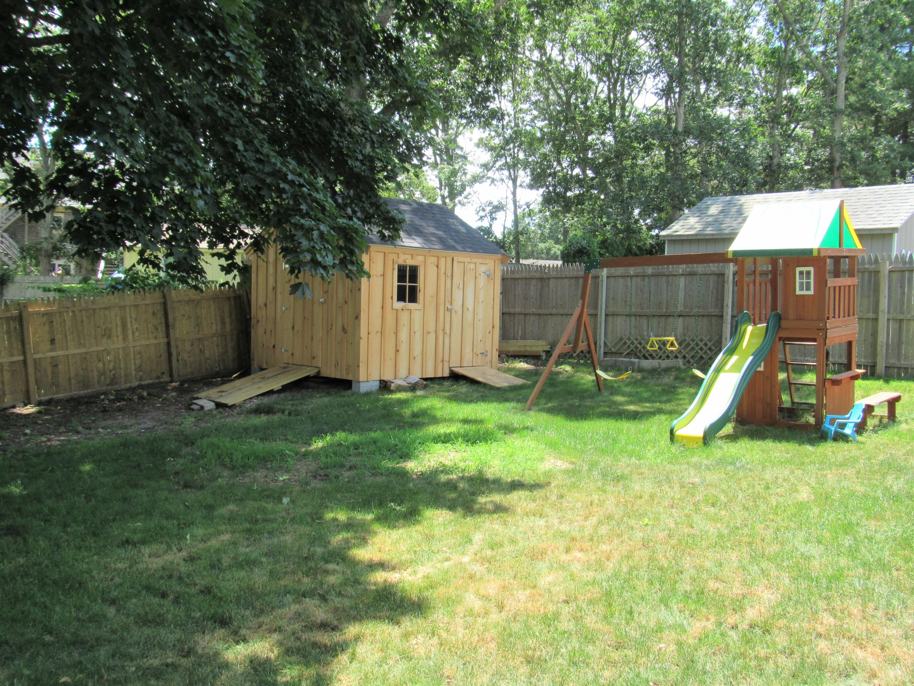 103 Baxter Road Hyannis, MA 02601 - Photo 26 of 31 a view of a backyard with a tree