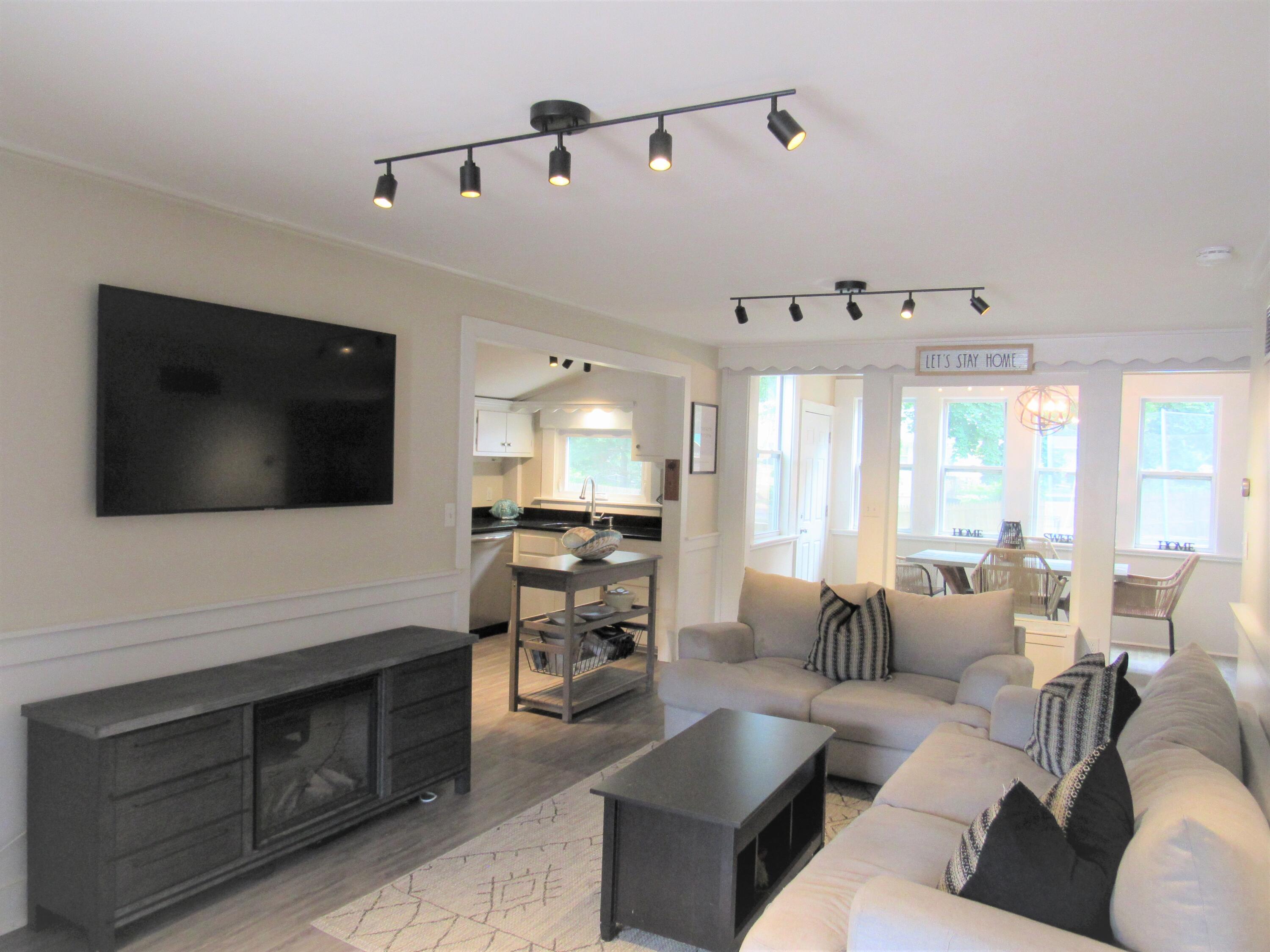 103 Baxter Road Hyannis, MA 02601 - Photo 4 of 31 a living room with furniture and a flat screen tv