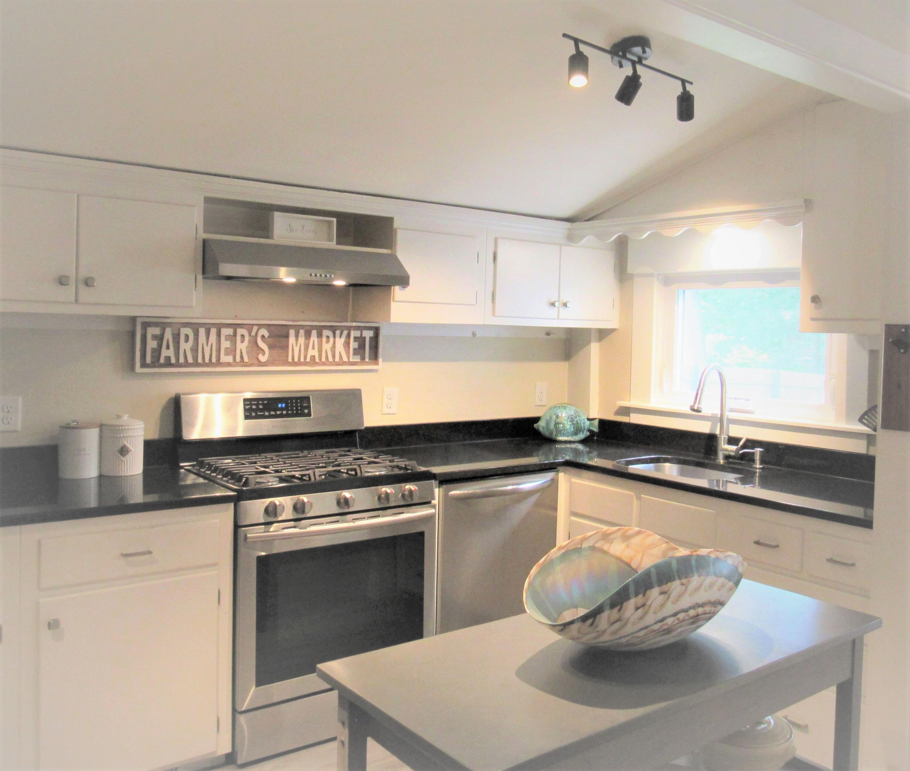 103 Baxter Road Hyannis, MA 02601 - Photo 8 of 31 a kitchen with stainless steel appliances granite countertop a sink and stove