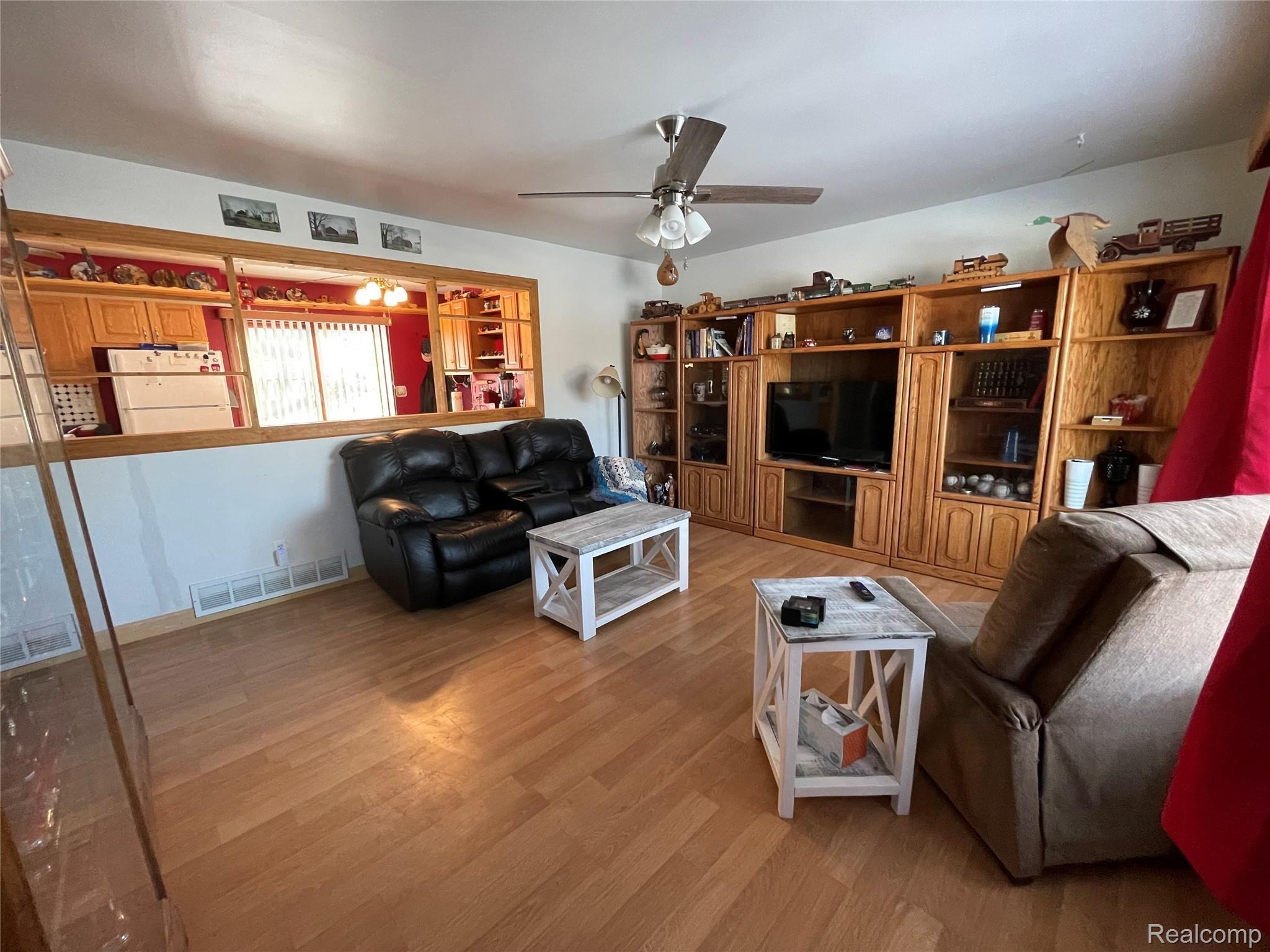 2700 East Wardlow Road Highland, MI 48356 - Photo 9 of 30 WARDLOW GREAT ROOM FROM FRONT DOOR.jpg