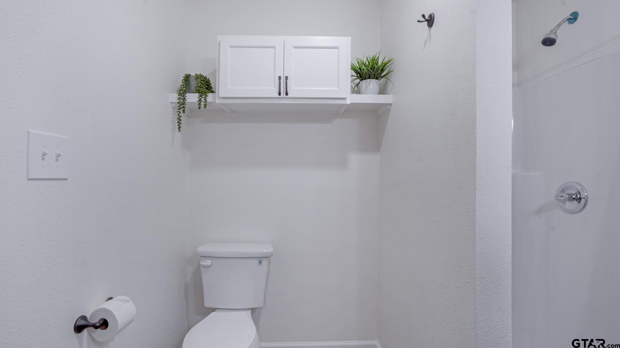 1925 Cushing Drive Tyler, TX 75702 - Photo 16 of 30 a bathroom with a toilet