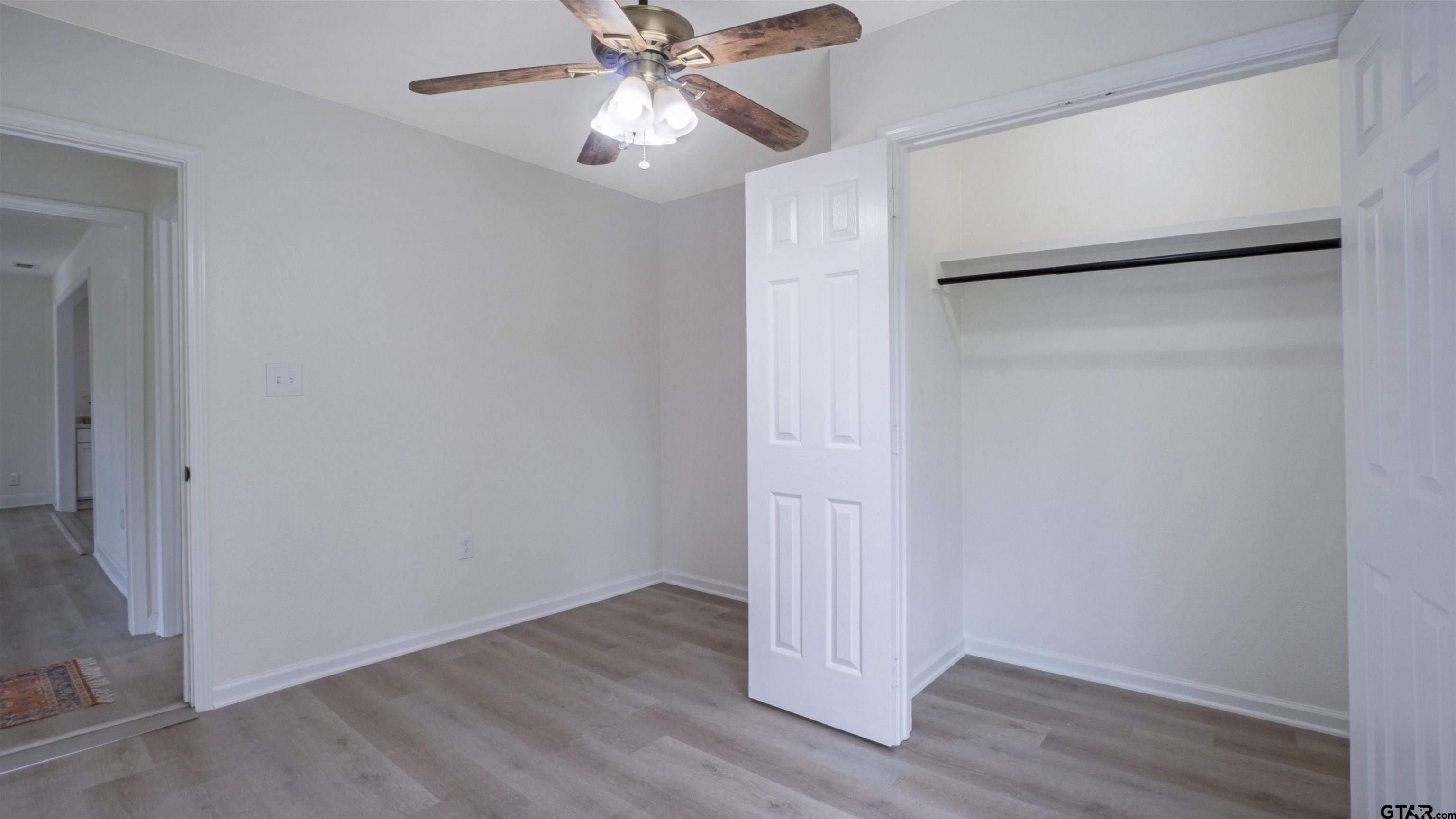 1925 Cushing Drive Tyler, TX 75702 - Photo 20 of 30 a view of an empty room with wooden floor
