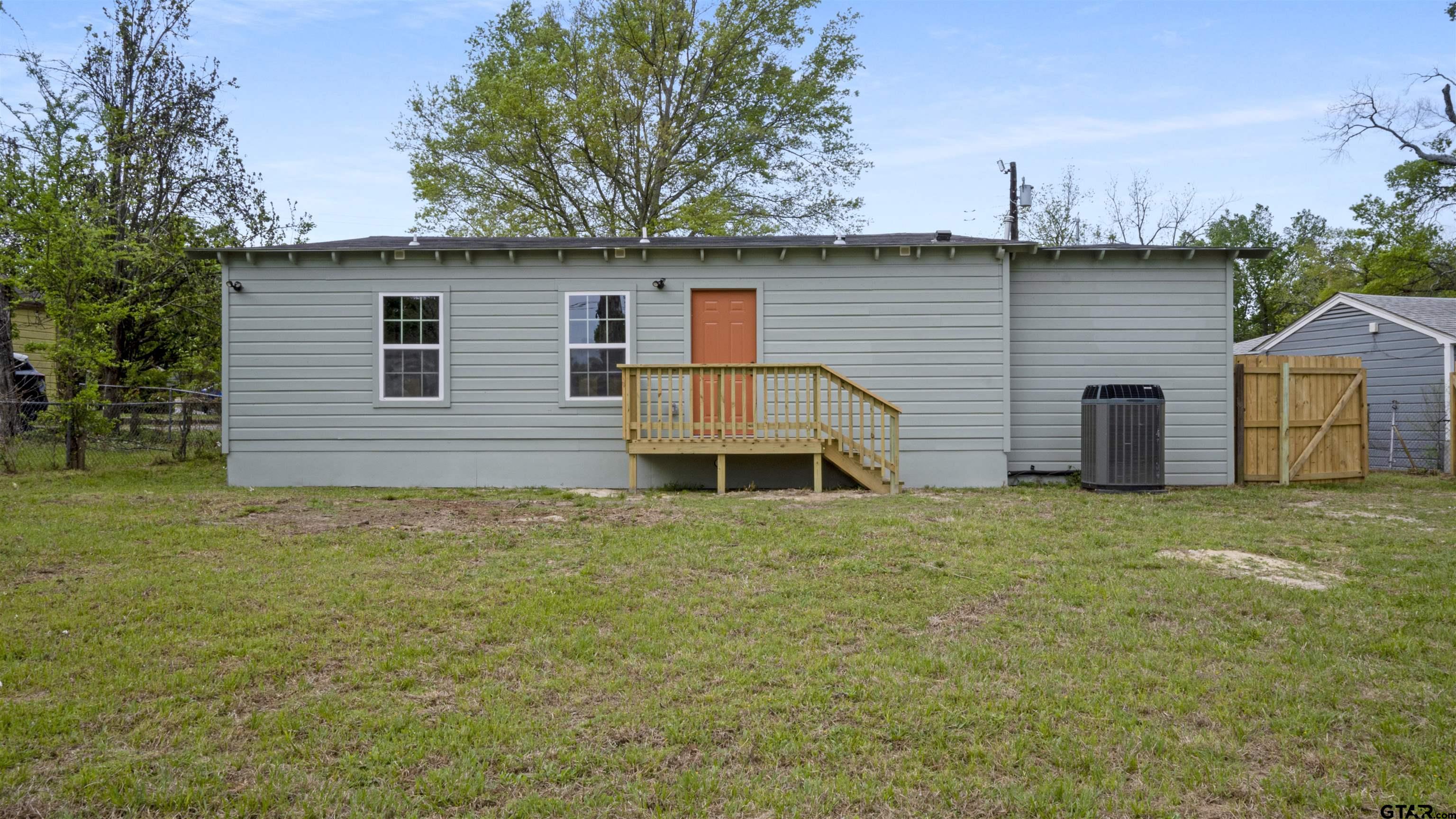 1925 Cushing Drive Tyler, TX 75702 - Photo 28 of 30 a backyard of a house with barbeque oven and brick wall