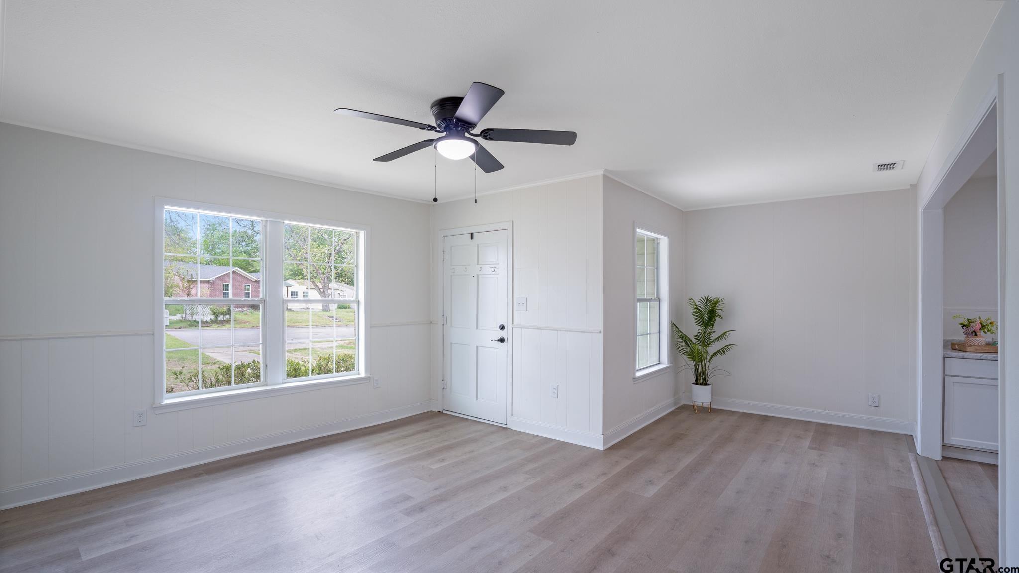 1925 Cushing Drive Tyler, TX 75702 - Photo 6 of 30 a view of empty room with wooden floor and window