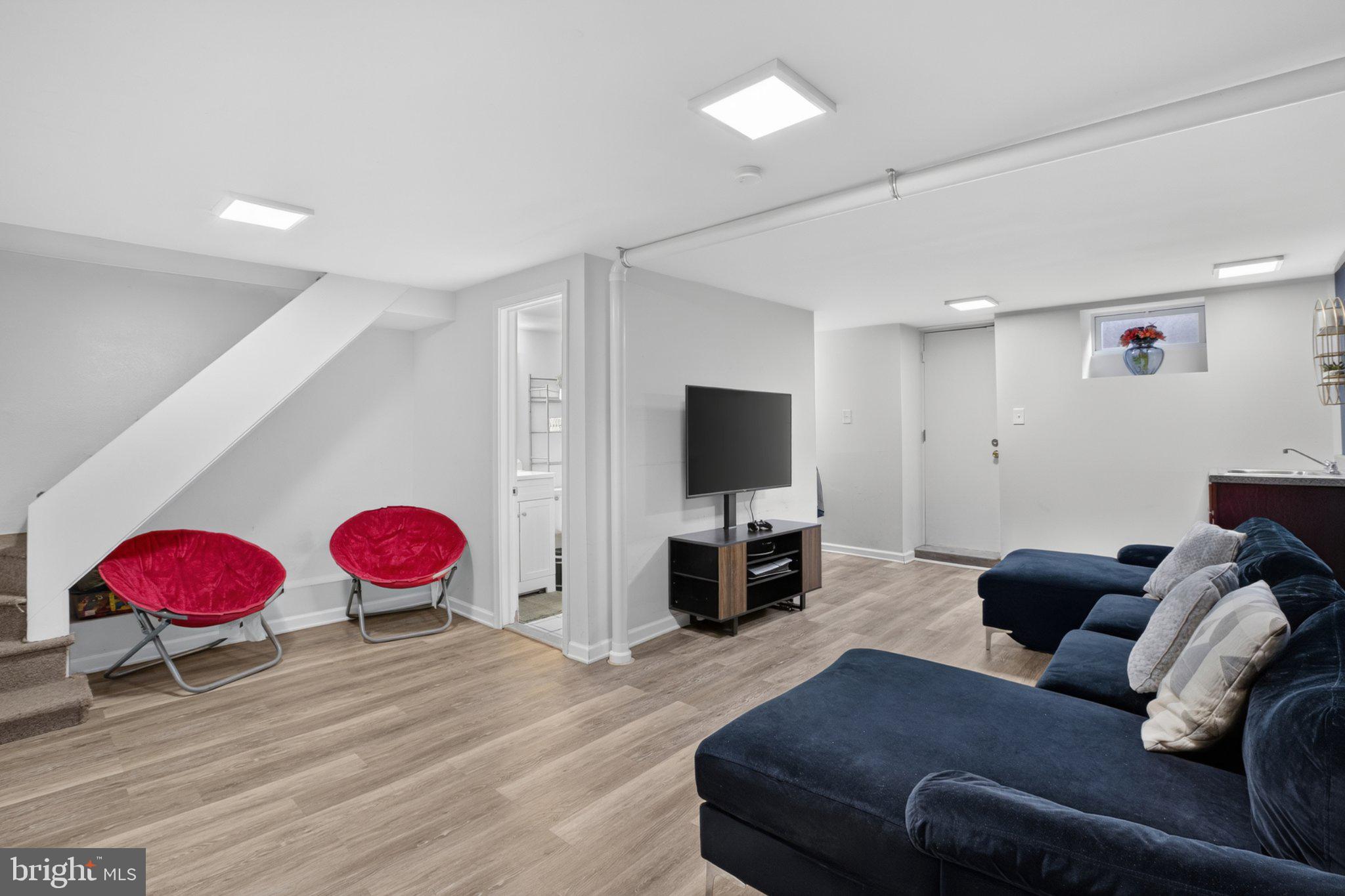 16 Underwood Road Wyncote, PA 19095 - Photo 18 of 40 Modern basement retreat with cozy vibes.