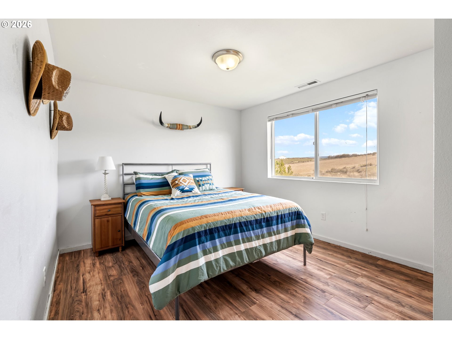 100 Grace Way Goldendale, WA 98620 - Photo 14 of 48 a bedroom with a bed and window