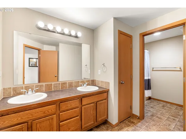 a bathroom with a bathtub and a sink