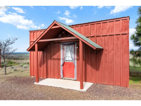 a view of a yard with an outdoor space