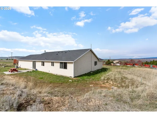 a picture of a room with a white wall and white cabinet