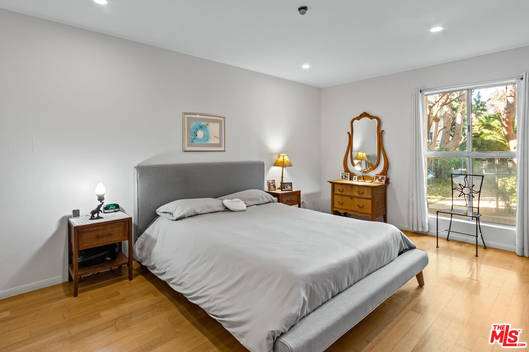 8103 Raintree Circle Culver City, CA 90230 - Photo 19 of 35 a bedroom with a bed and a table