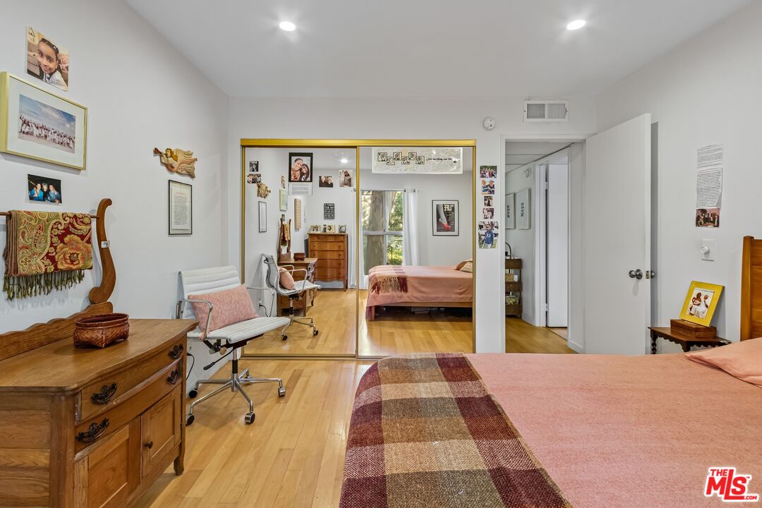 8103 Raintree Circle Culver City, CA 90230 - Photo 20 of 35 a bedroom with furniture and a bed