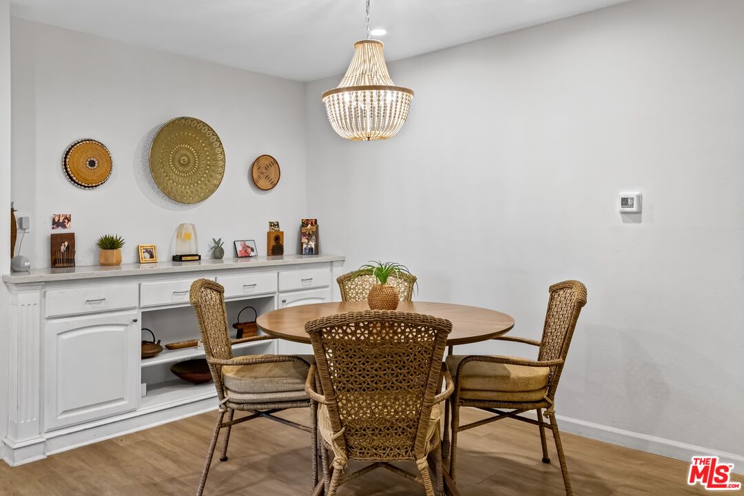 8103 Raintree Circle Culver City, CA 90230 - Photo 23 of 35 a dining room with furniture and window