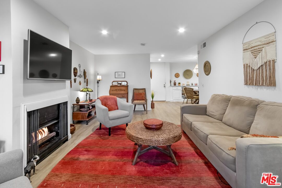 8103 Raintree Circle Culver City, CA 90230 - Photo 24 of 35 a living room with furniture and a fireplace