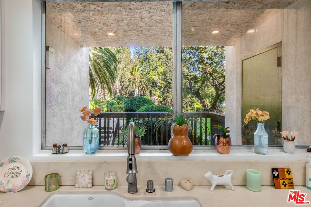 8103 Raintree Circle Culver City, CA 90230 - Photo 25 of 35 a dining room with furniture and a large window