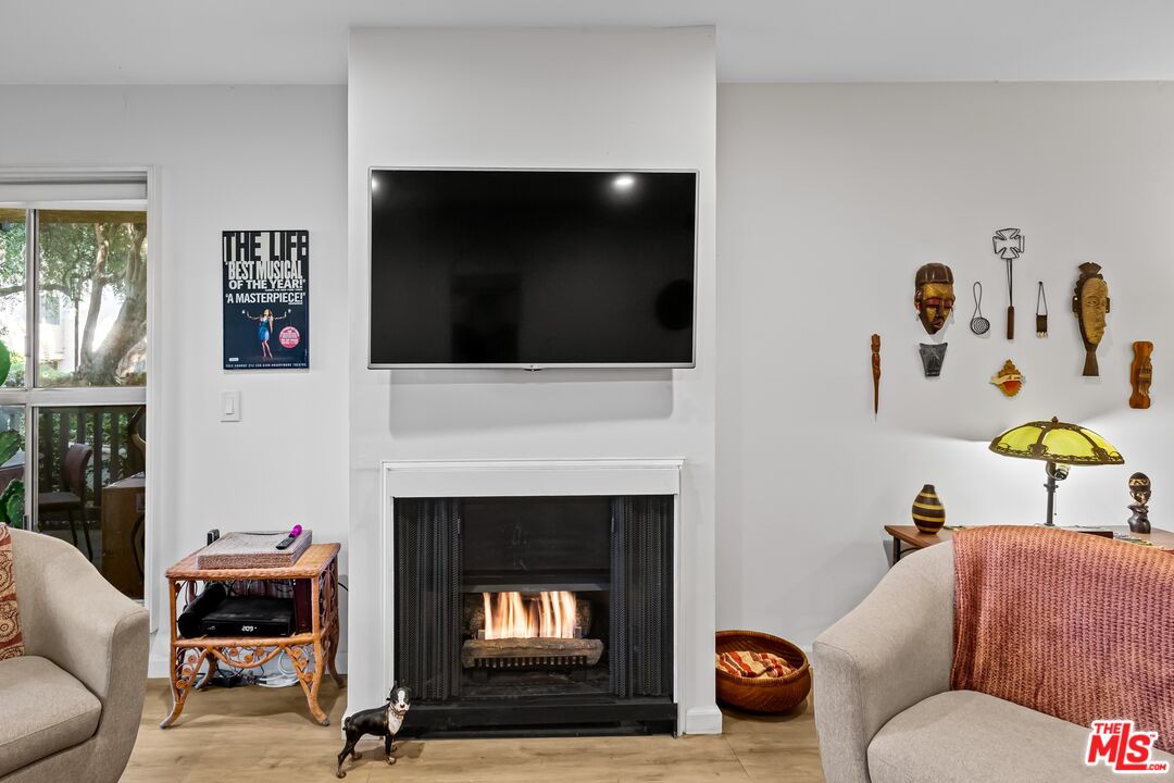 8103 Raintree Circle Culver City, CA 90230 - Photo 28 of 35 a living room with furniture fireplace and flat screen tv