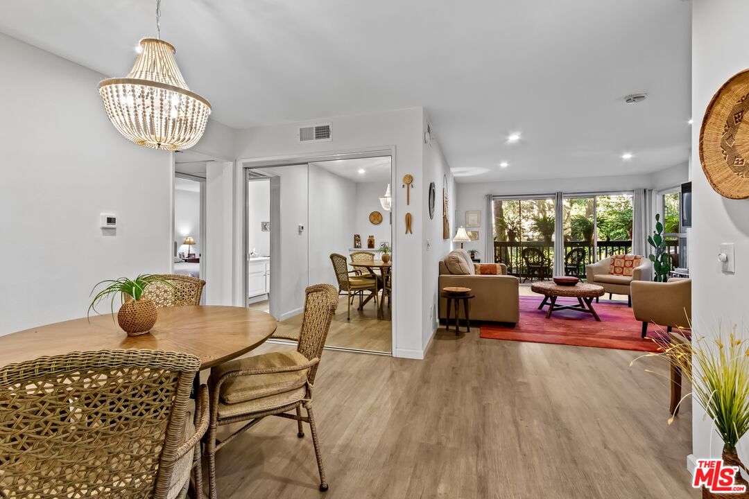 8103 Raintree Circle Culver City, CA 90230 - Photo 30 of 35 a view of a dining room with furniture and wooden floor