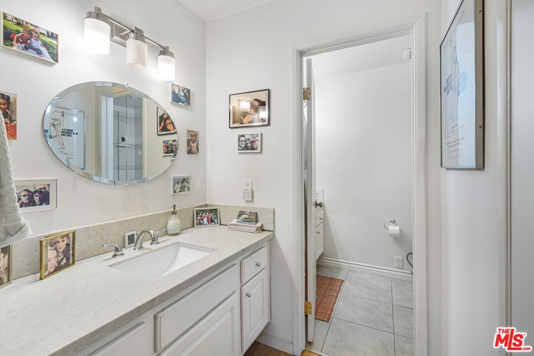 8103 Raintree Circle Culver City, CA 90230 - Photo 31 of 35 a spacious bathroom with a double vanity sink and a mirror