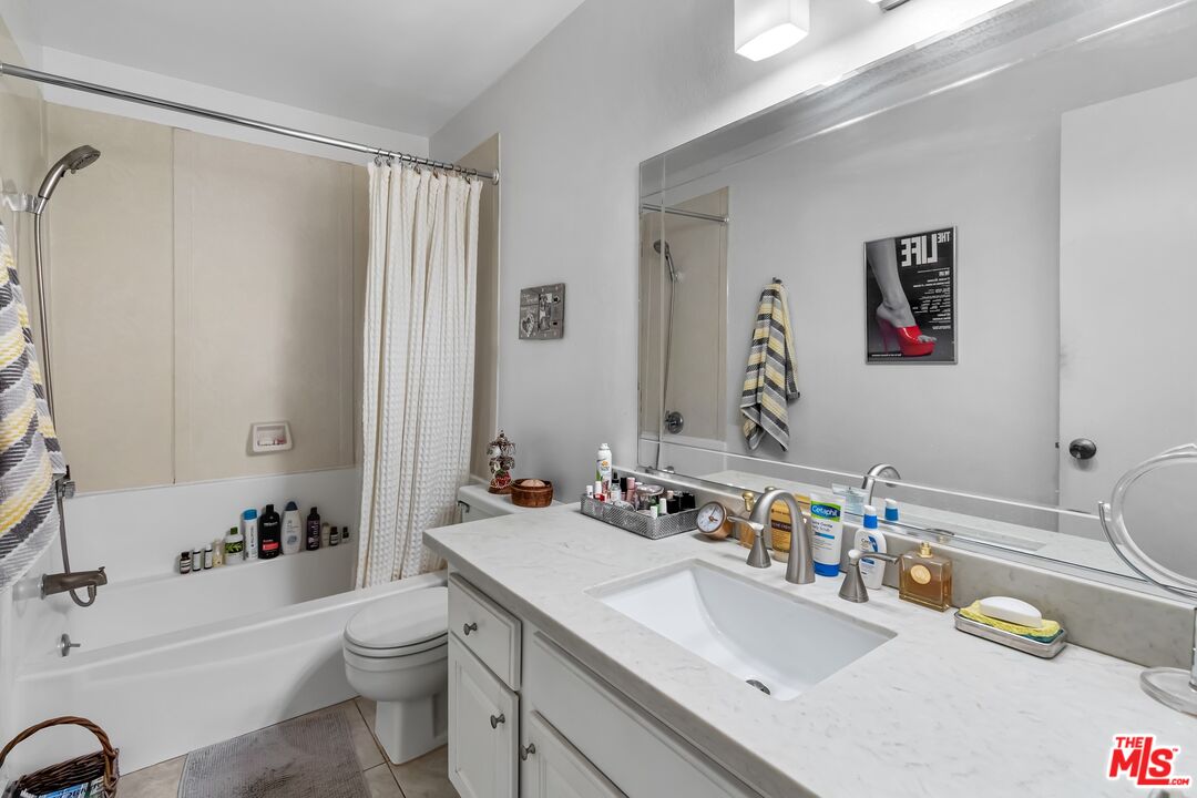 8103 Raintree Circle Culver City, CA 90230 - Photo 34 of 35 a bathroom with a sink a toilet and shower