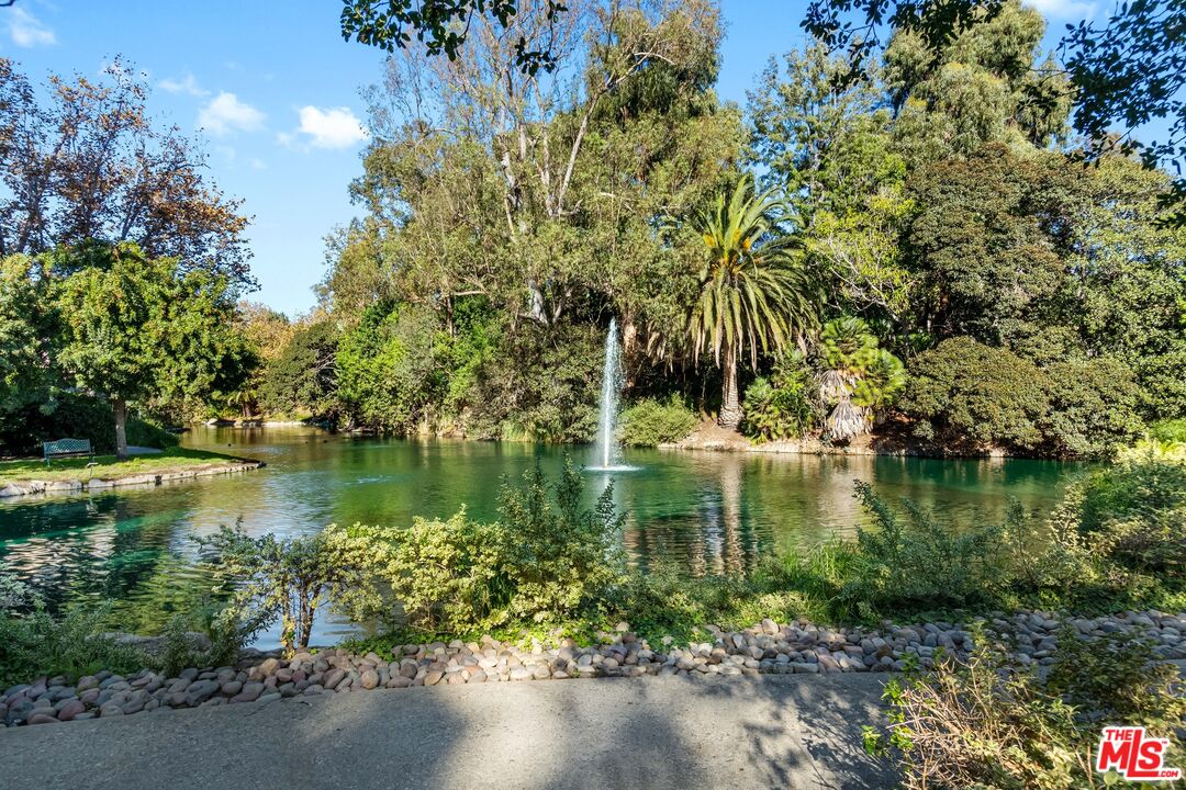 8103 Raintree Circle Culver City, CA 90230 - Photo 5 of 35 a view of a lake with a building in the background