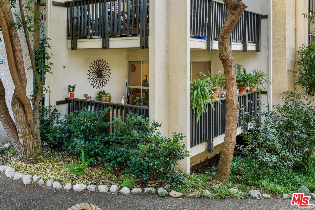 8103 Raintree Circle Culver City, CA 90230 - Photo 10 of 35 a house with potted plants in front of door