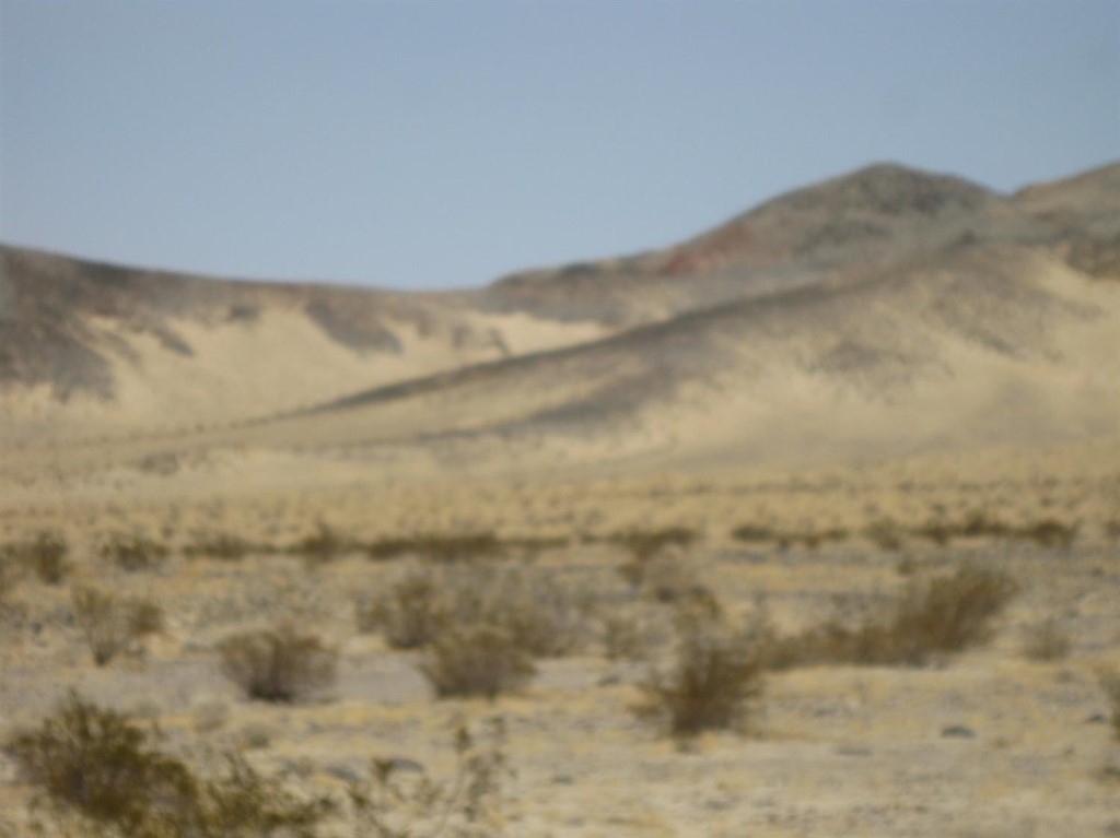 5128 Riverside Road Newberry Springs, CA 92365 - Photo 1 of 1 a view of a dry room with mountains in the background