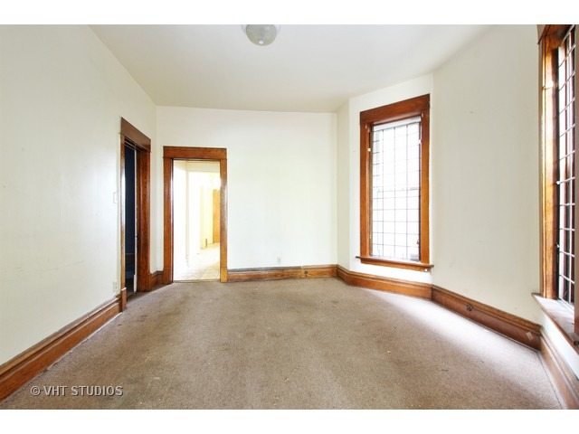 6045 South Peoria Street Chicago, IL 60621 - Photo 5 of 10 a view of an empty room with a window