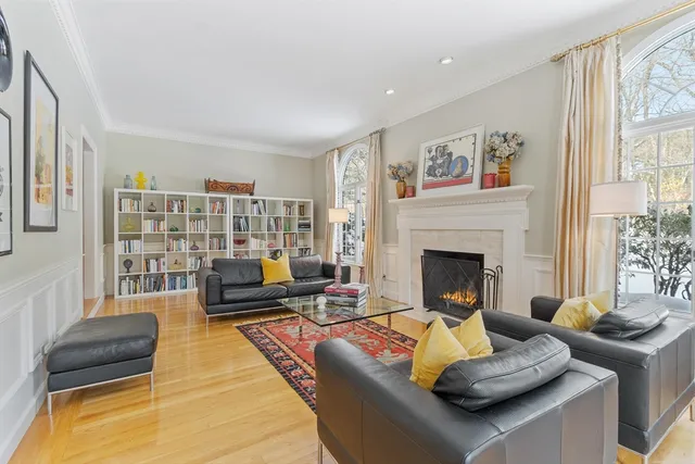 a living room with furniture fireplace and window