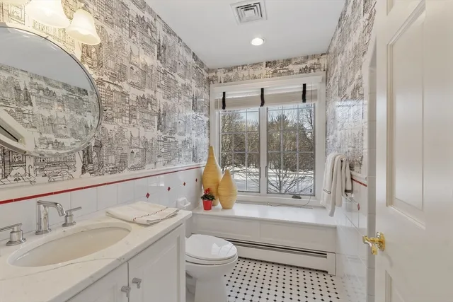 a bedroom with furniture and wooden floor