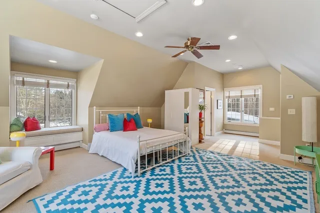 a bedroom with furniture and a chandelier