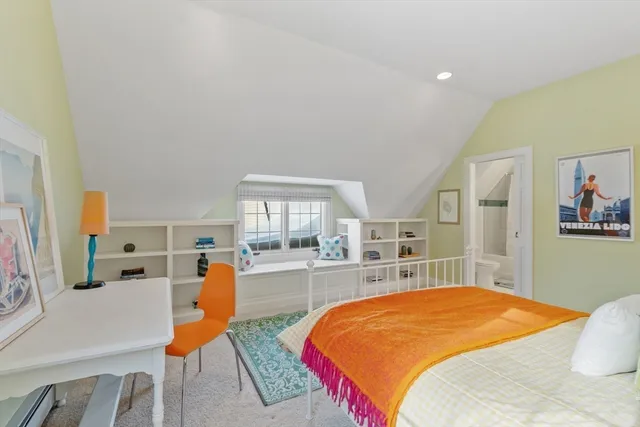 a bed room with a bed and a book shelf