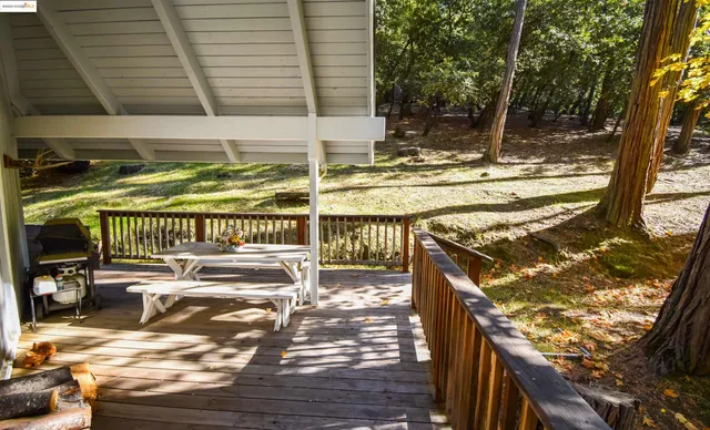 a view of a balcony with two chairs and a table