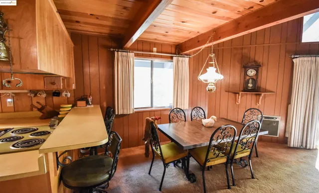 a dining room with furniture and window