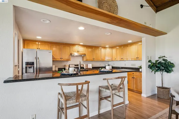 a kitchen with a table and chairs in it