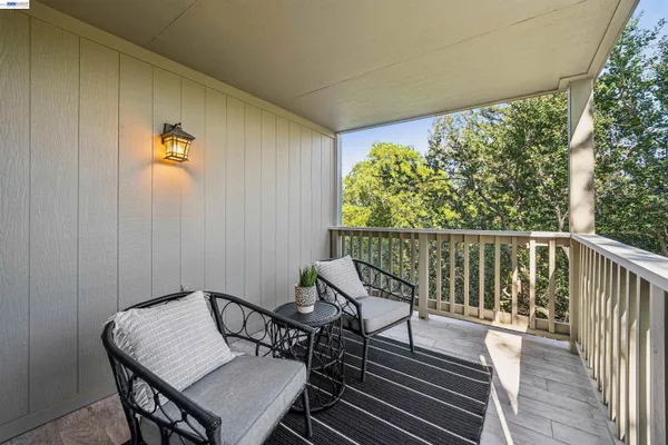 a view of balcony with furniture