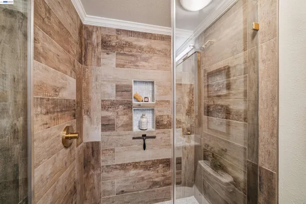a bathroom with a glass shower door