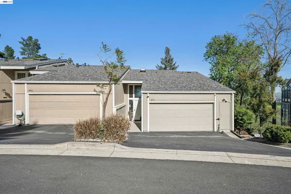 a view of a house with a garage