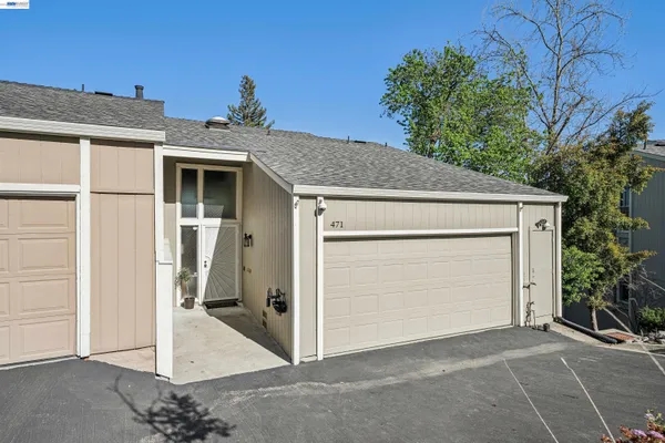 a front view of a house with a garage