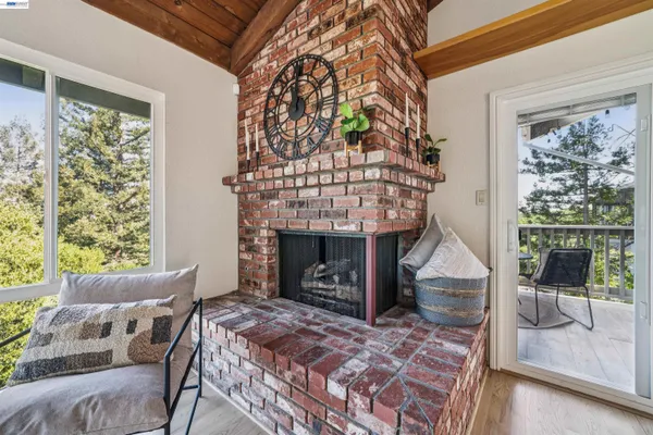 a bedroom with a bed and a fireplace